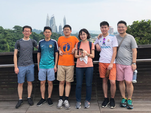 Ishisone (3rd from right) and lab members on a sightseeing trip