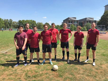 Oktiovan (far left) and football club members