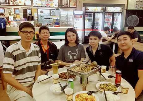 Ran (center) having lunch with lab members