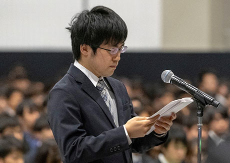 Representative for master's and doctoral students delivering a statement