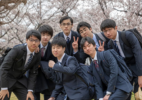 Group of new students posing for cameras