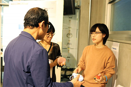 CBEC student (right) explaining Nigi-nigi Bravo, a device that enhances experiences of blind soccer spectators