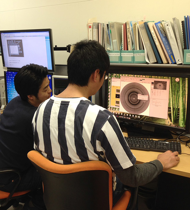 Researchers working in the control room