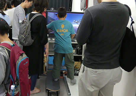 Youngster testing out equipment at information science lab