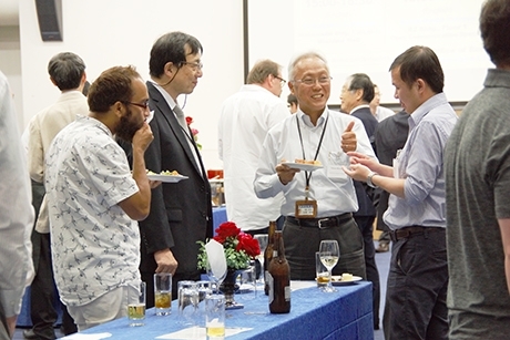 EVP Mizumoto (center) with attendees