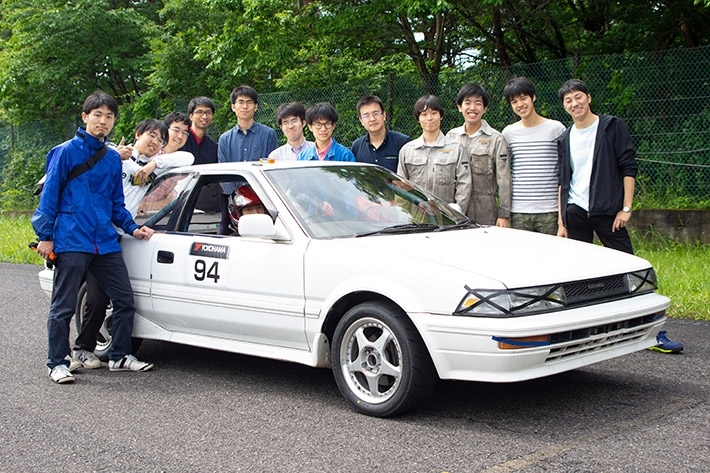 Automobile Club members around winning machine