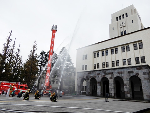 Firefighters "extinguishing" Main Building