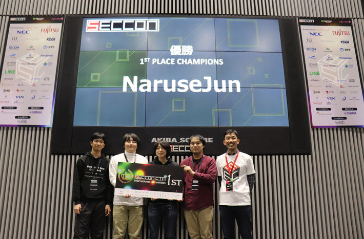 Team NaruseJun with SECCON 2019 Chairman Tomohiro Hanada (right)