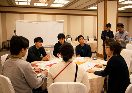 Discussions with mentor Saijo (seated far right)
