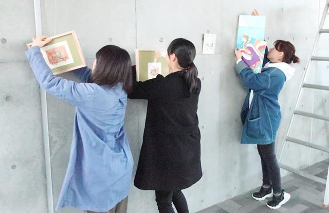 Art Club members setting up their exhibition