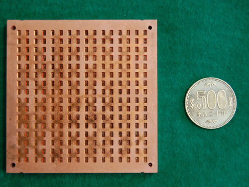 A waveguide slot array antenna fabricated by diffusion bonding of laminated copper thin plates.