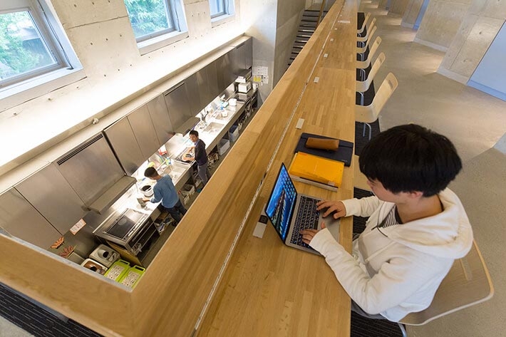 study space overlooking dormitory kitchen, Midorigaoka House