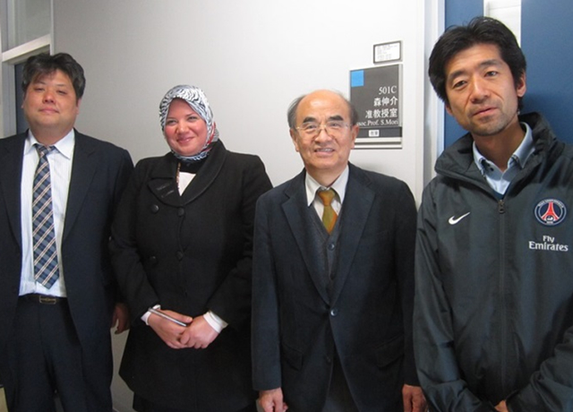 Engy (second from left) with Tokyo Tech Associate Professor Mori (right) in front of his lab