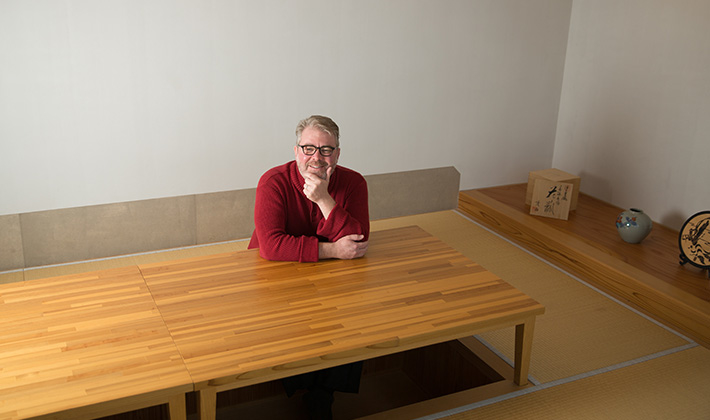 Hernlund in an ELSI meeting room designed in traditional Japanese decor. The space includes tatami mats and hori-gotatsu (a low table with legroom recessed into the floor).