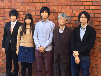 Professor Asahi (second from right) and Sato (far right) with lab members