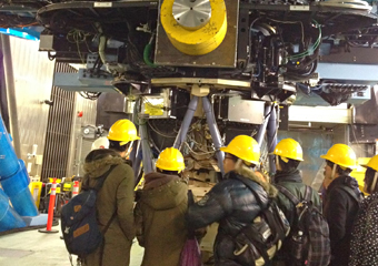 Listening to an explanation at the base of the Subaru Telescope