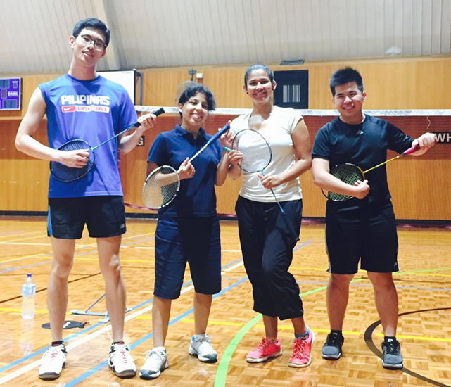 Harigaya (left) playing badminton with new friends