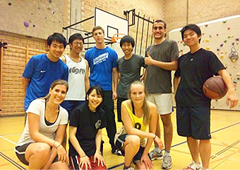 Yabu (front row, second from left) with friends at a basketball game
