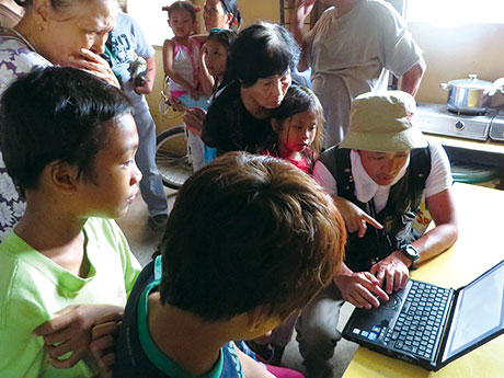 Philippines Interviewing a family who evacuated by walkinged through floodwater of a storm surge