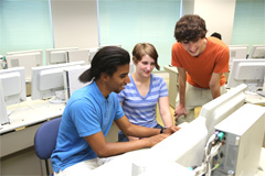 Smith (left) in a computer room