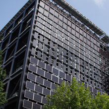 Solar panels cover the building's south, west and top surfaces