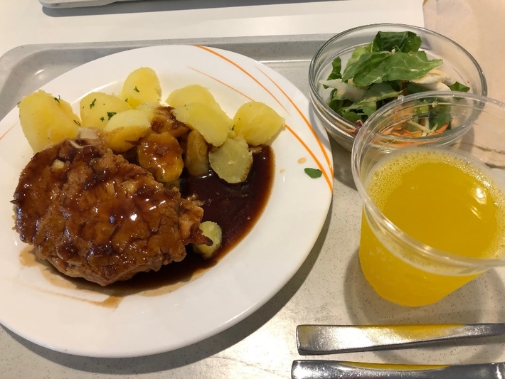 and one day’s lunch（right,  pork  steak, salad  and  orange  juice）