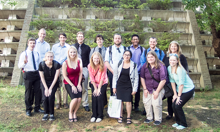 Group photo of UC students and faculty with Associate Professor Tom Hope