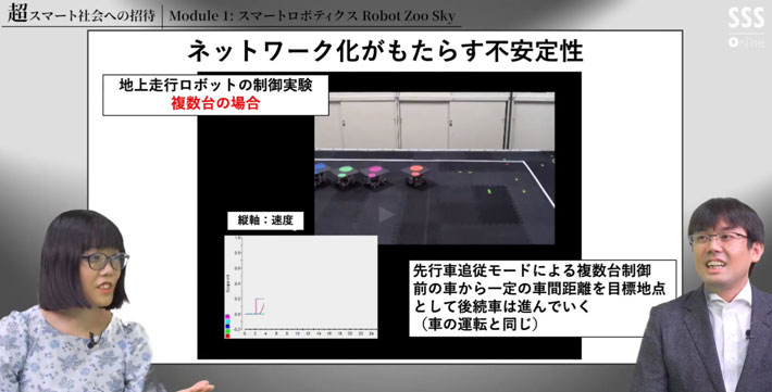 地上走行ロボットの制御実験について話す畑中准教授（右）と多久和講師（左）