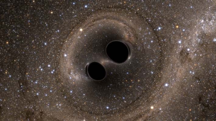 重力波を生んだブラックホール合体のイメージ Courtesy Caltech/MIT/LIGO Laboratory